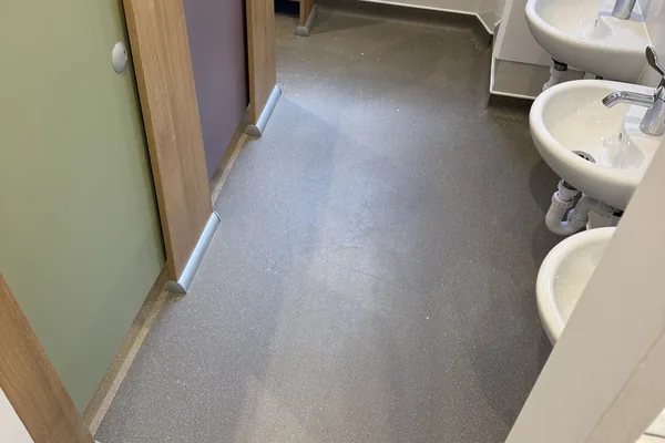Vinyl shaped and welded around the wet area fittings