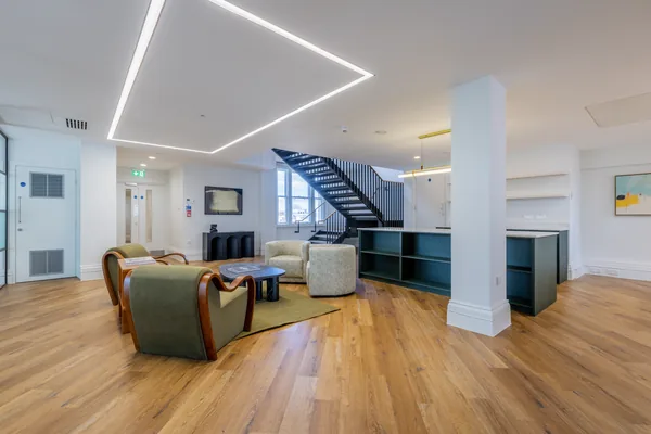The kitchen and staircase, wood flooring carried through