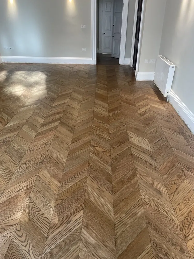 Chevron parquet floor in a family home fitted by Guild Floors